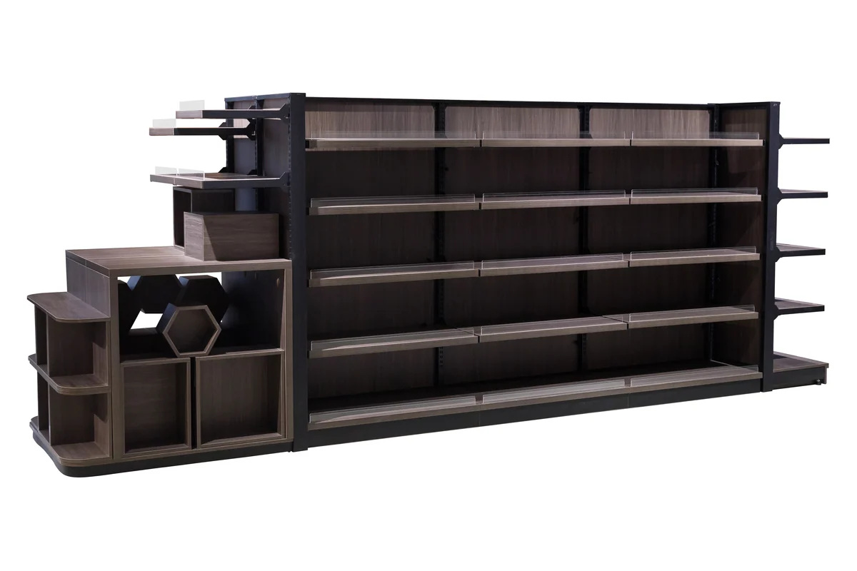 Long dark timber single-sided supermarket shelving run with a stepped end display unit