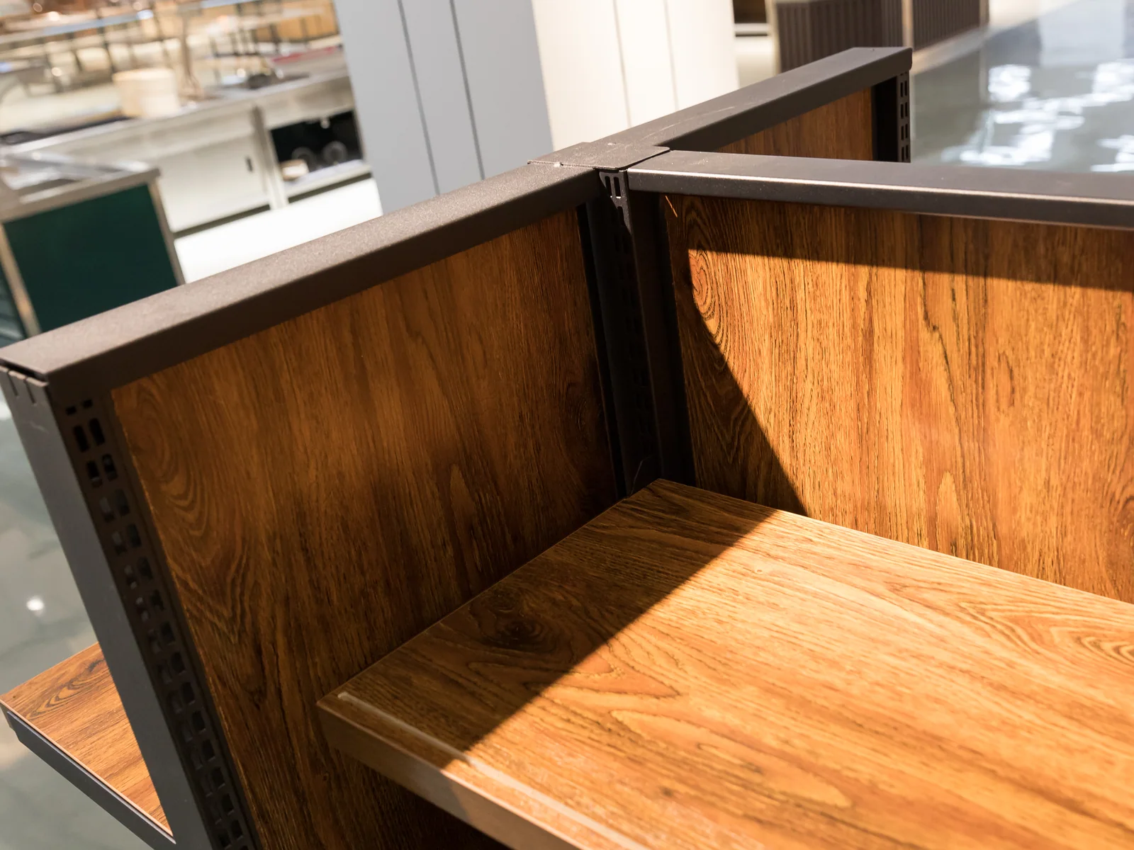 Double sided gondola shelving run photographed from the end showing both faces