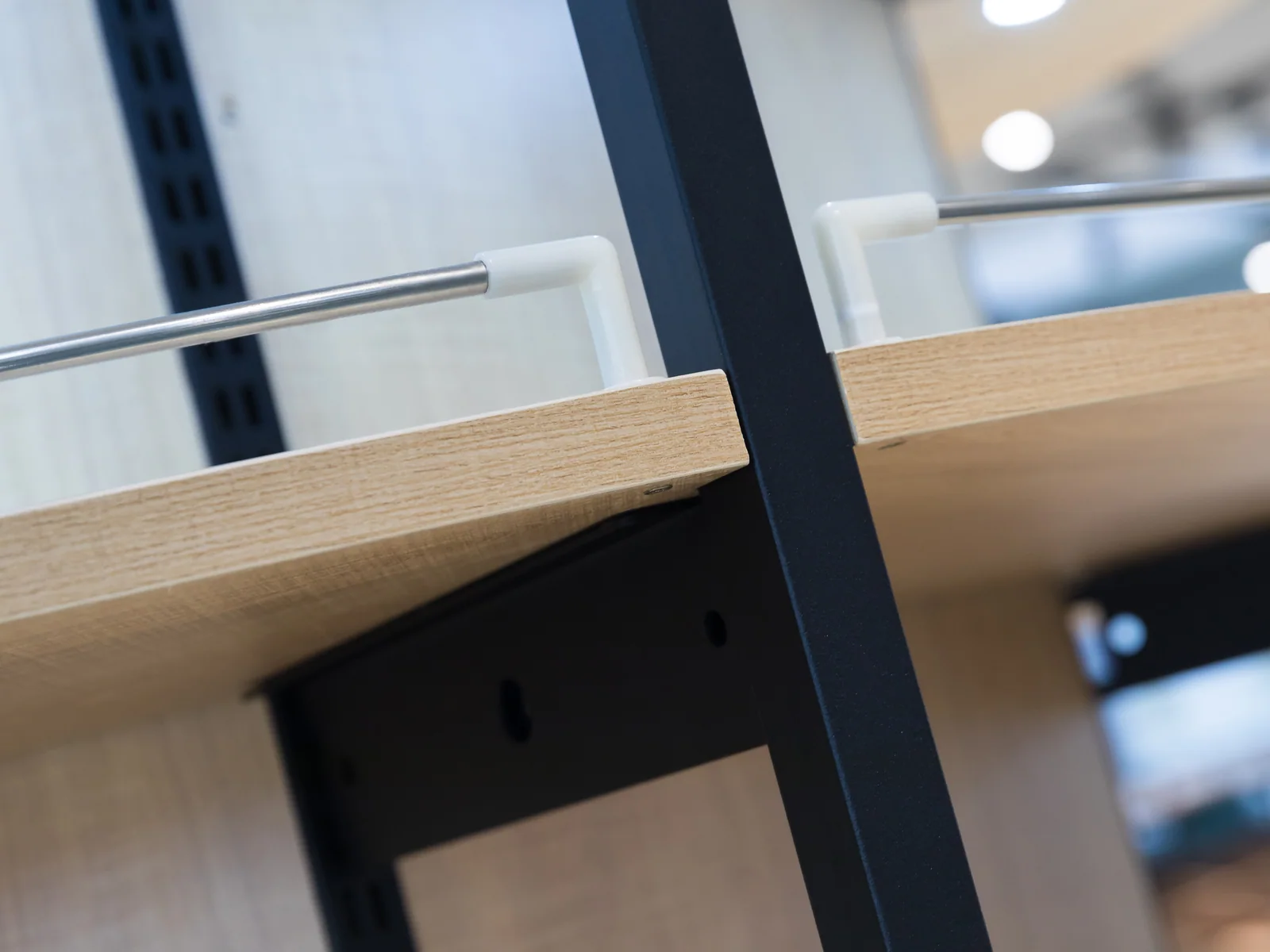 Circular shelving column photographed from an angle showing the full height rings