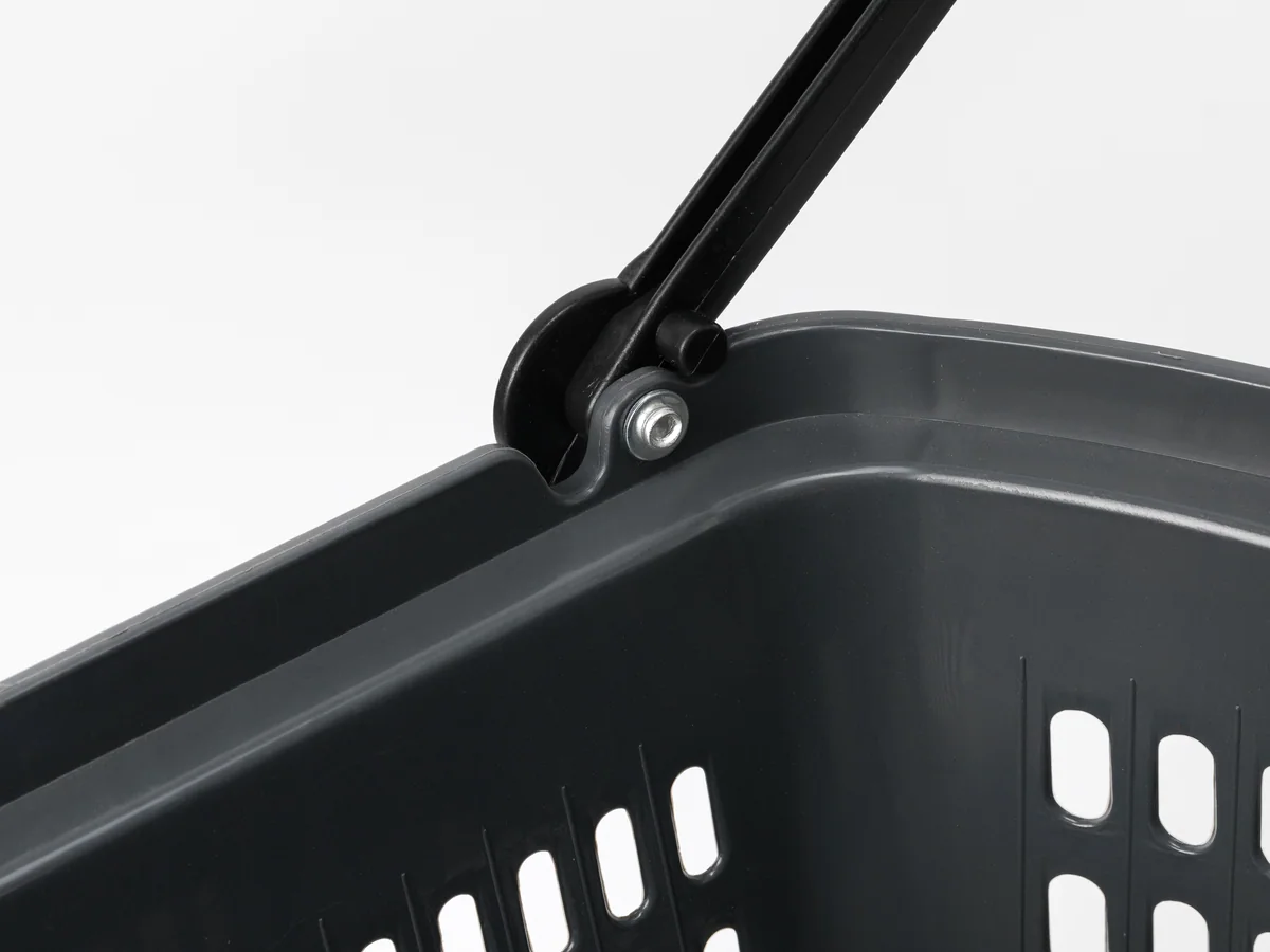 Close-up of a wheel and its mounting under the basket