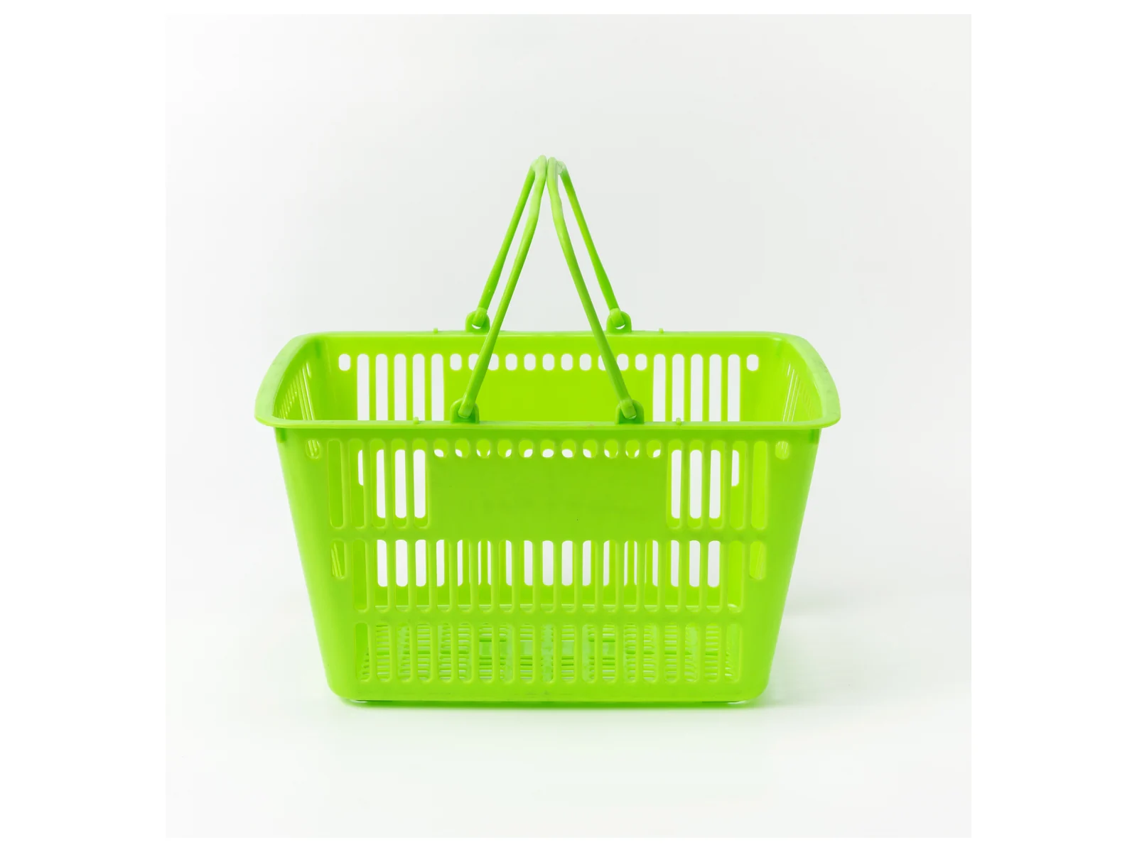 Green Hand Basket with Twin Handles on a white studio background