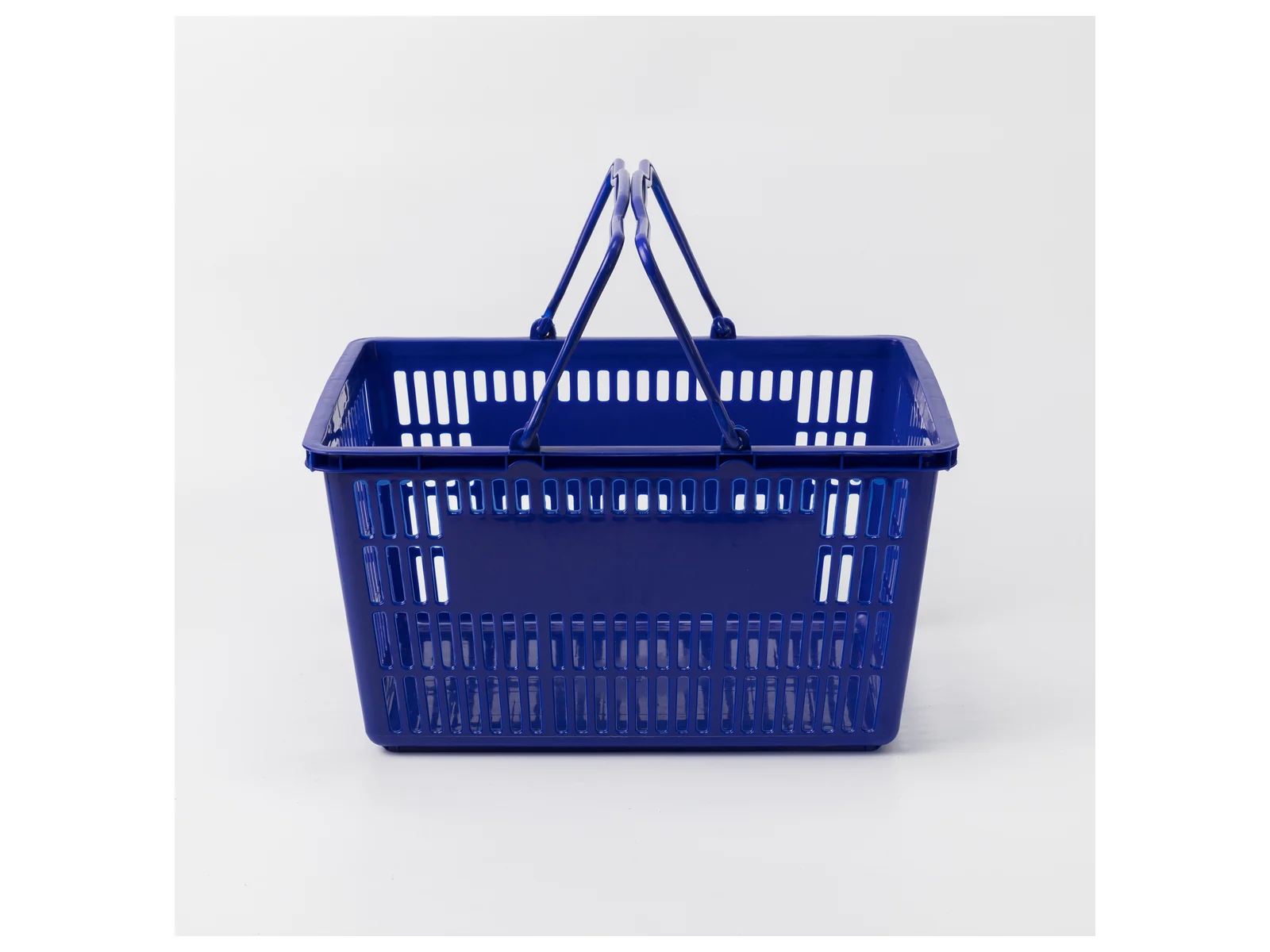 Blue Hand Basket with Twin Handles on a white studio background