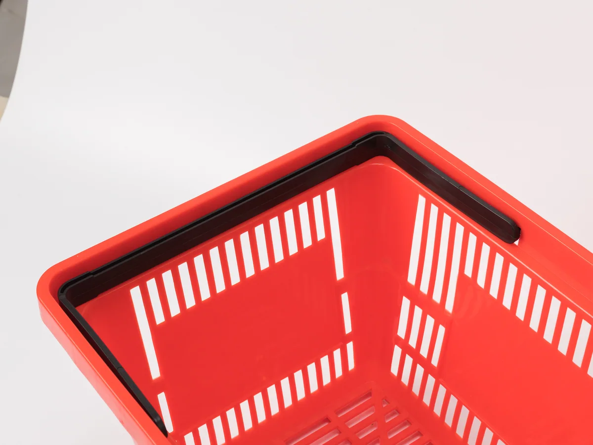 Close-up of a stack of red baskets showing the massed colour