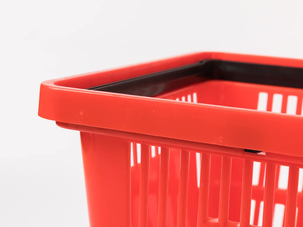 Close-up of the red surface under retail lighting