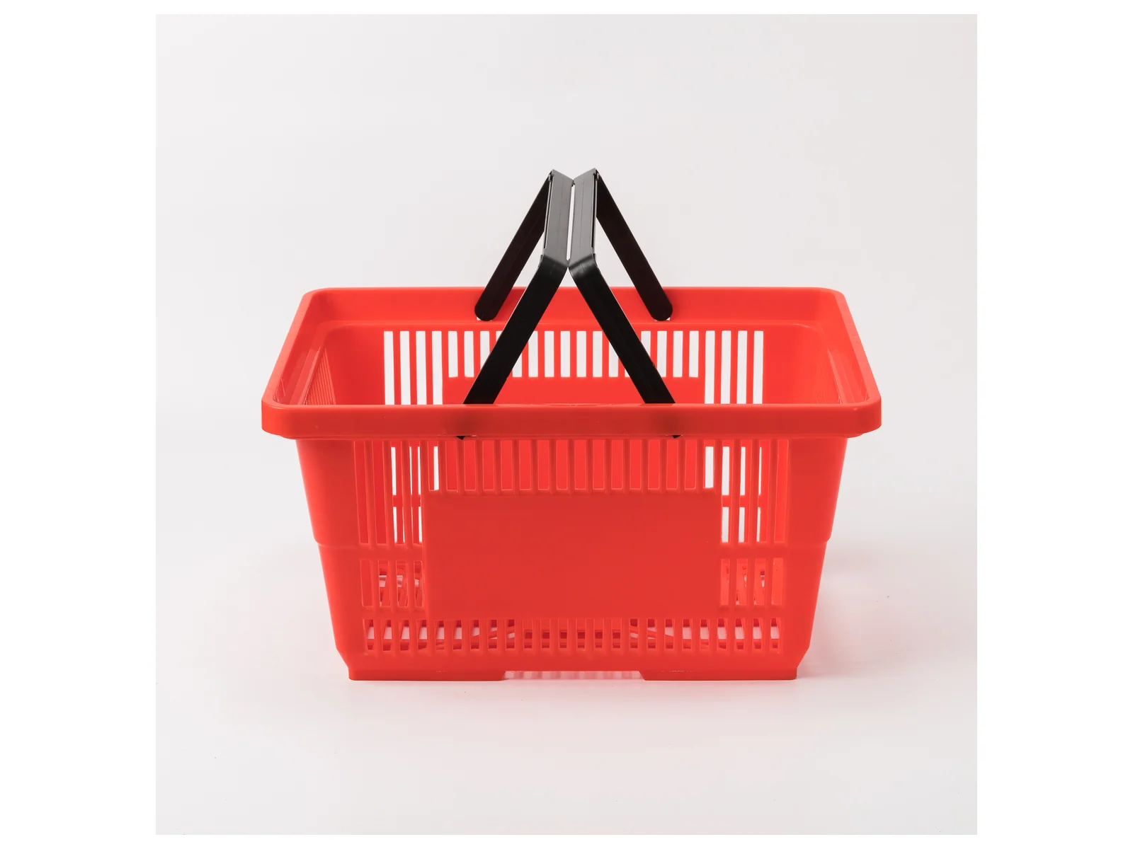 Red Hand Basket with Twin Handles on a white studio background