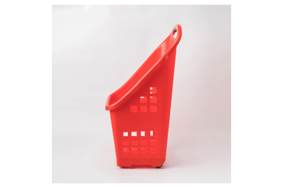 Slim red upright supermarket shopping basket on a narrow wheeled base