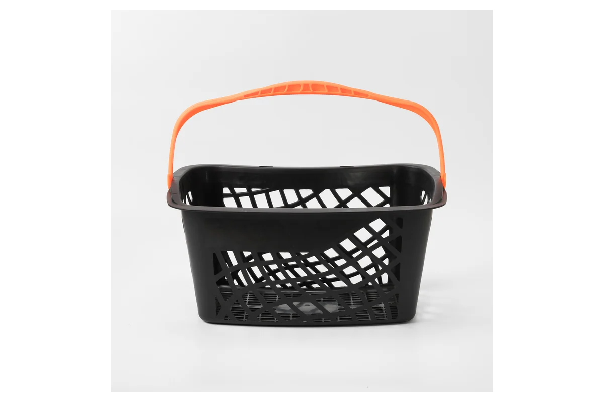 Black supermarket rolling shopping basket with an orange grip that folds flat onto the rim