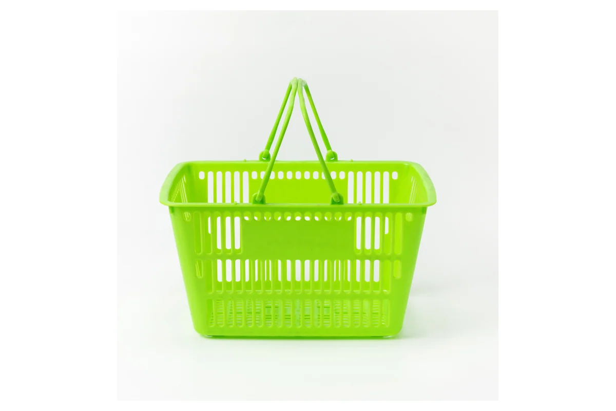 Bright green moulded supermarket hand basket with twin folding handles
