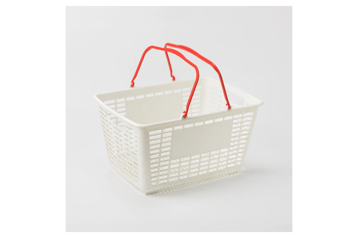 White moulded supermarket hand basket with contrasting red twin folding handles