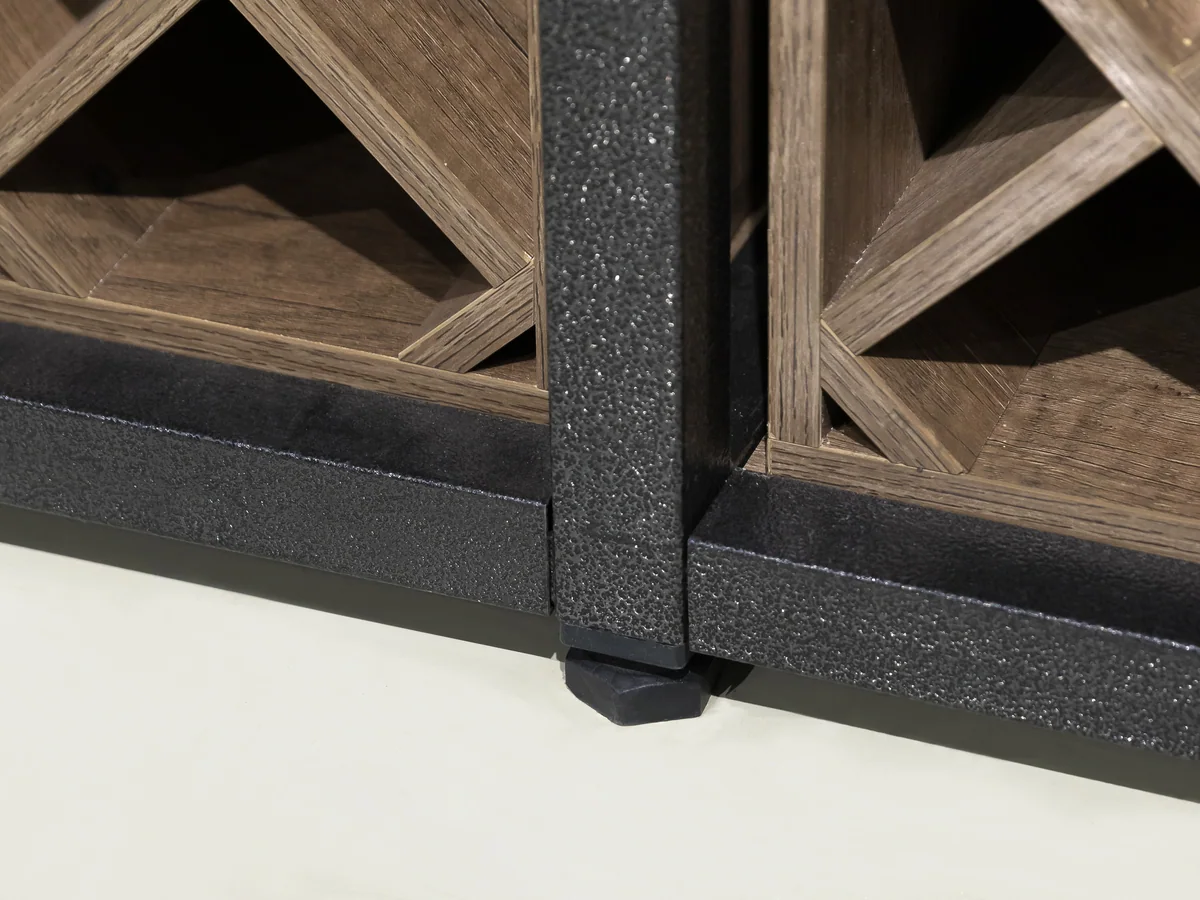 Close-up of a lit display shelf at the top of the wine wall