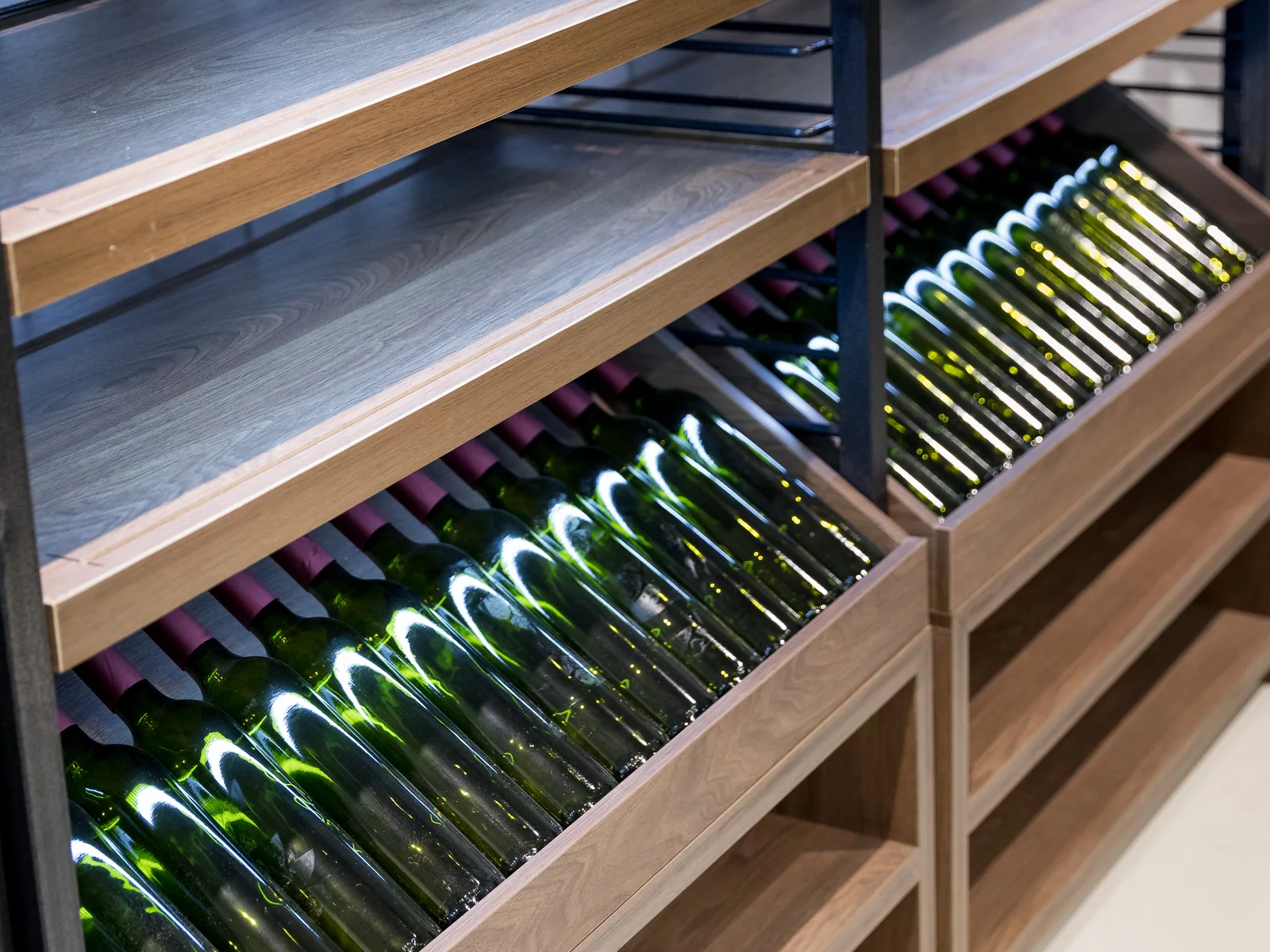 Wine display photographed straight on showing the angled shelves and fretwork panels