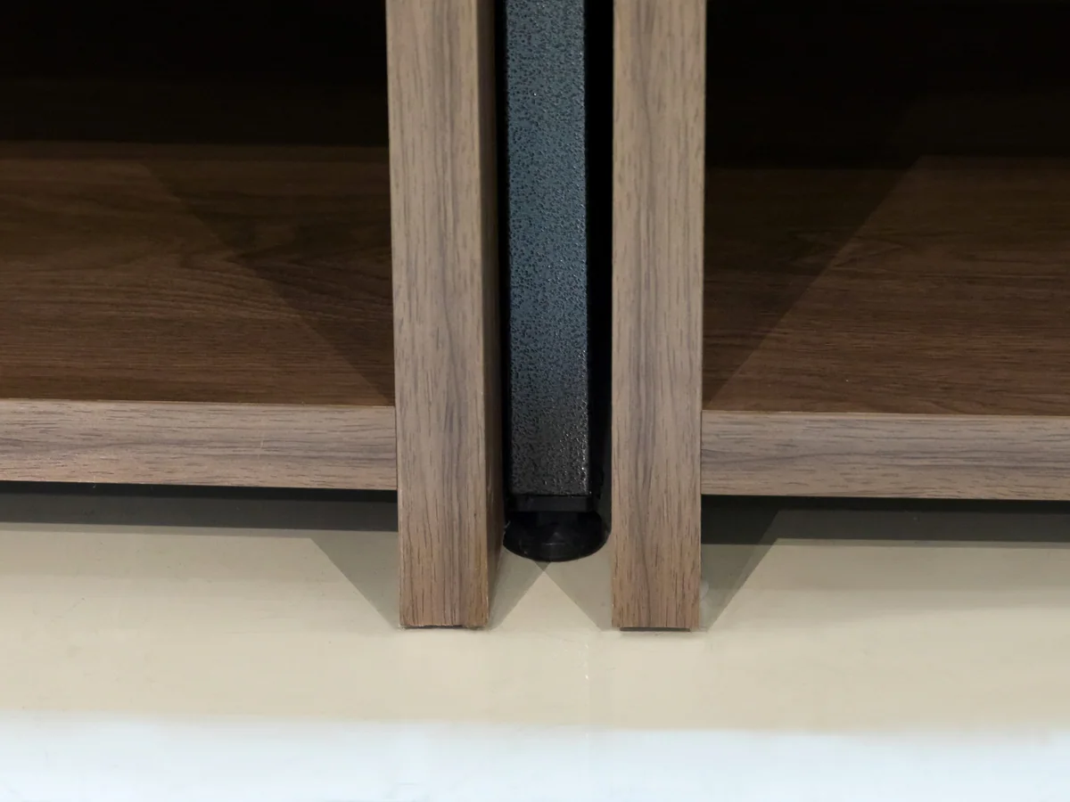 Close-up of the black steel frame around the compartment grid