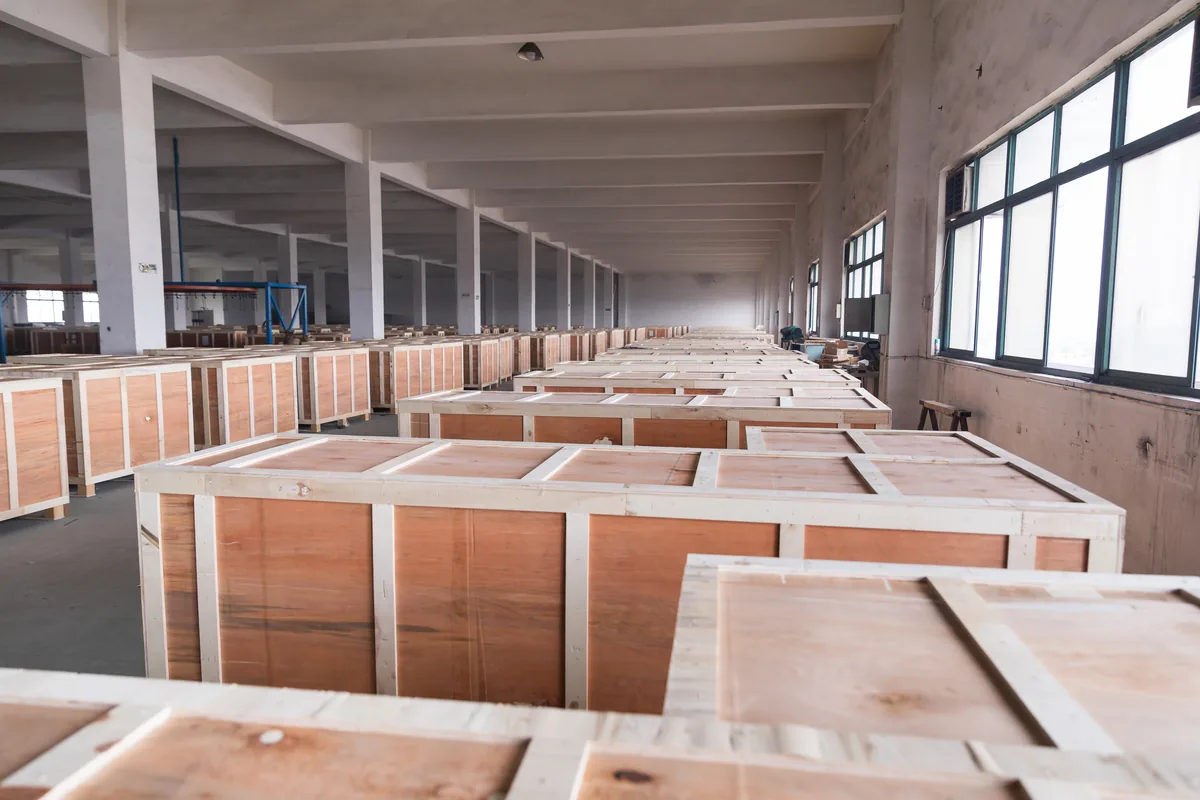 Timber export crates for a supermarket equipment order lined up in the Keshun workshop at Changshu